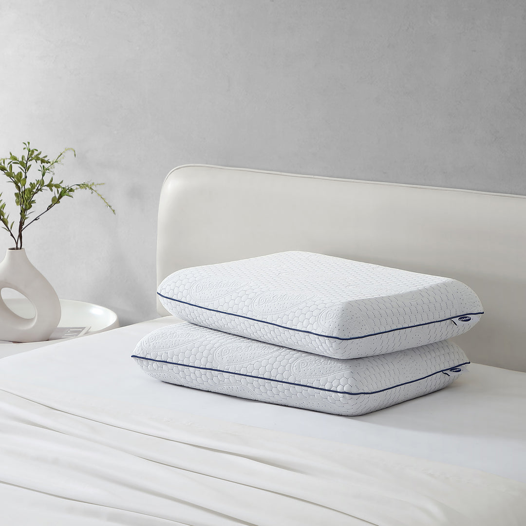 Dr. Scholl's™ Air-Pillo™ Plus pillow displayed on a queen-size bed.