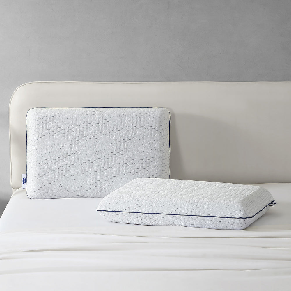 Dr. Scholl's™ Air-Pillo™ Plus pillow displayed on a queen-size bed.